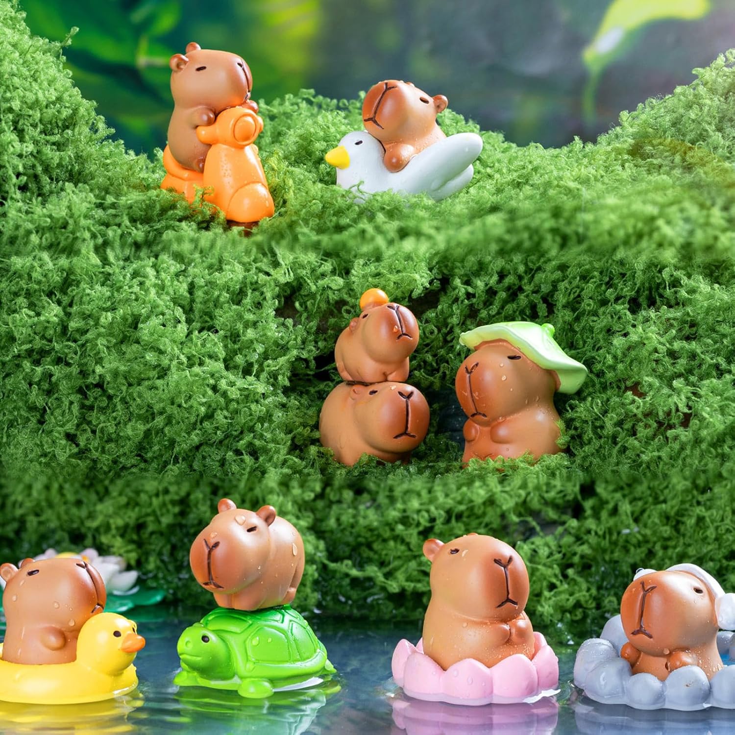 Thirteen small resin capybara figurines in various poses arranged together