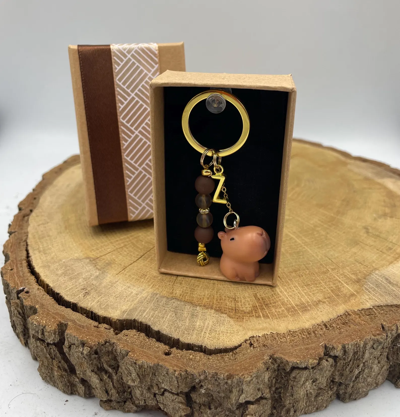 Handmade capybara keychain made of metal wire, colorful beads and charms