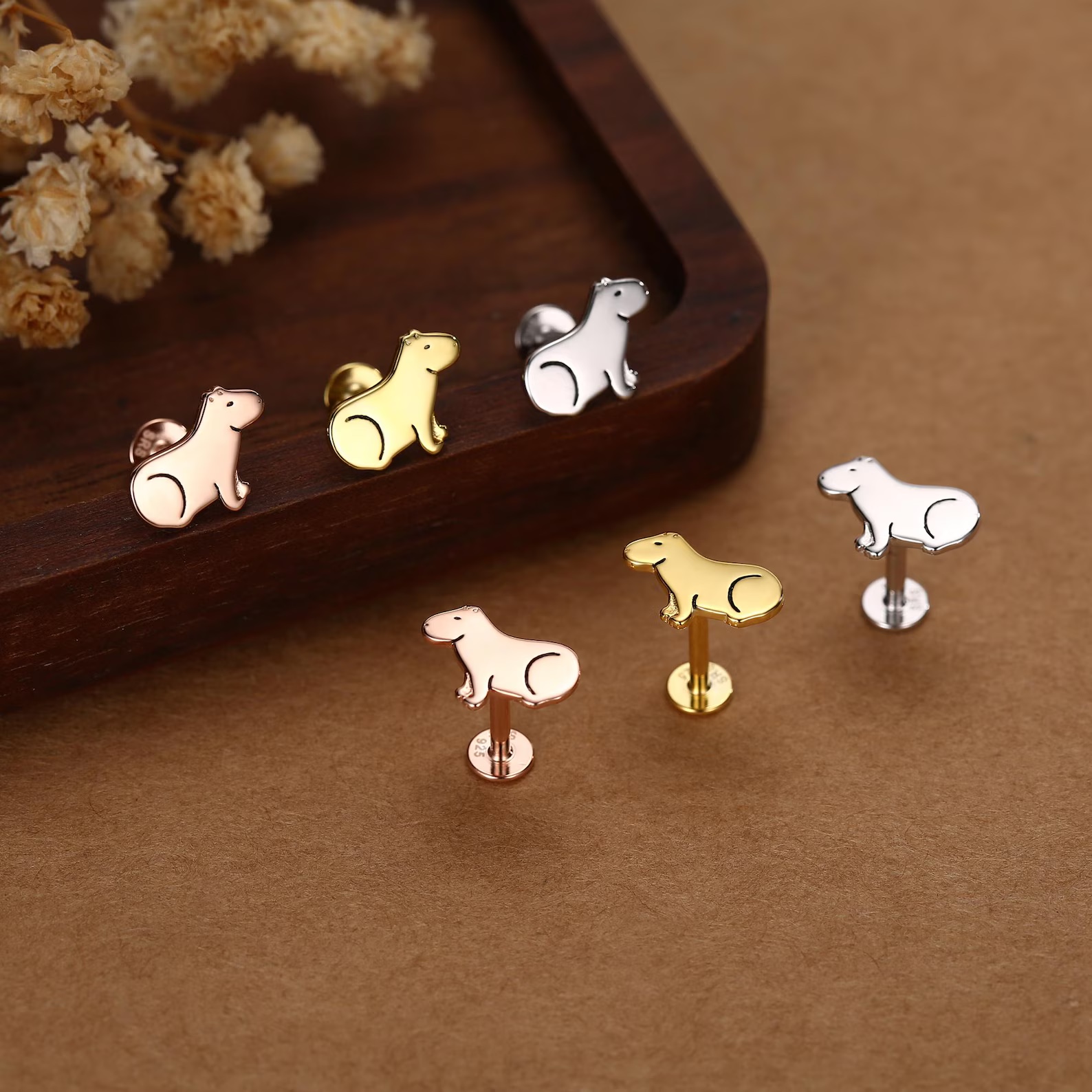 Sterling silver flat back earrings with tiny engraved capybara design